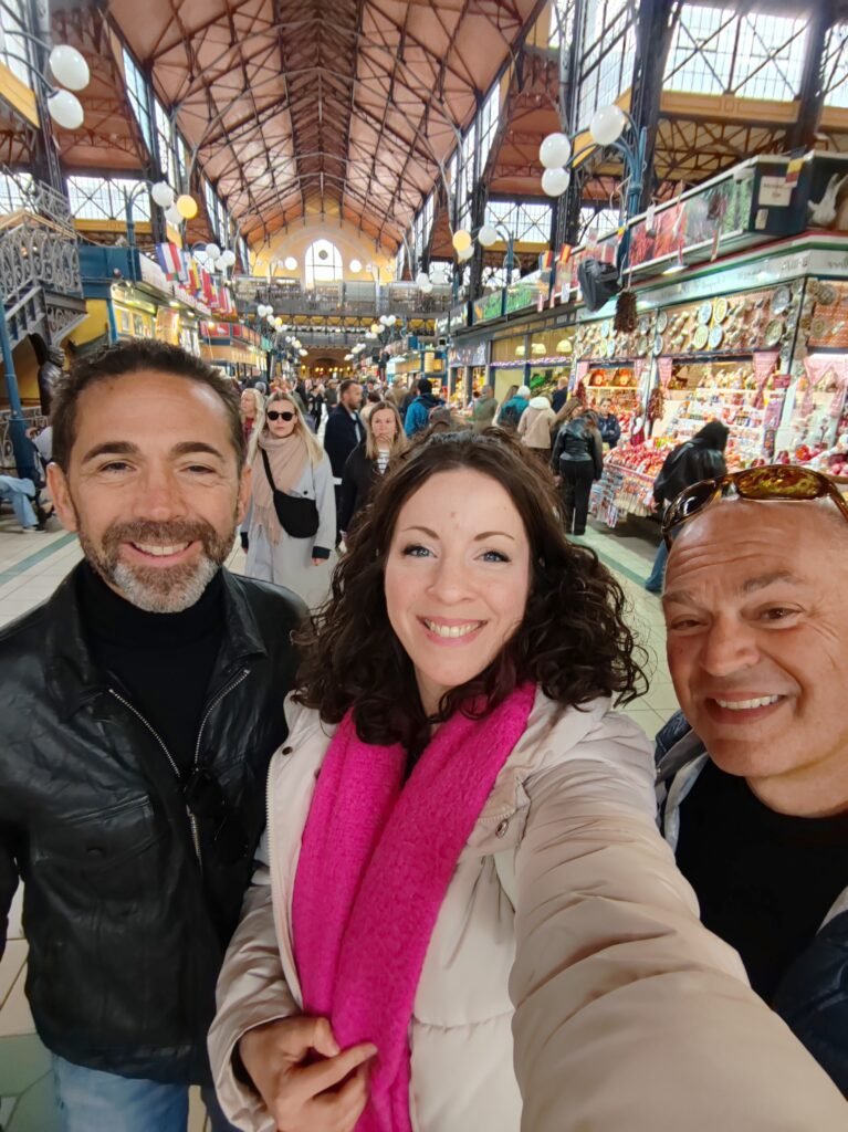 Guests exploring the Great Market Hall during a private Budapest food tour with a licensed local guide.